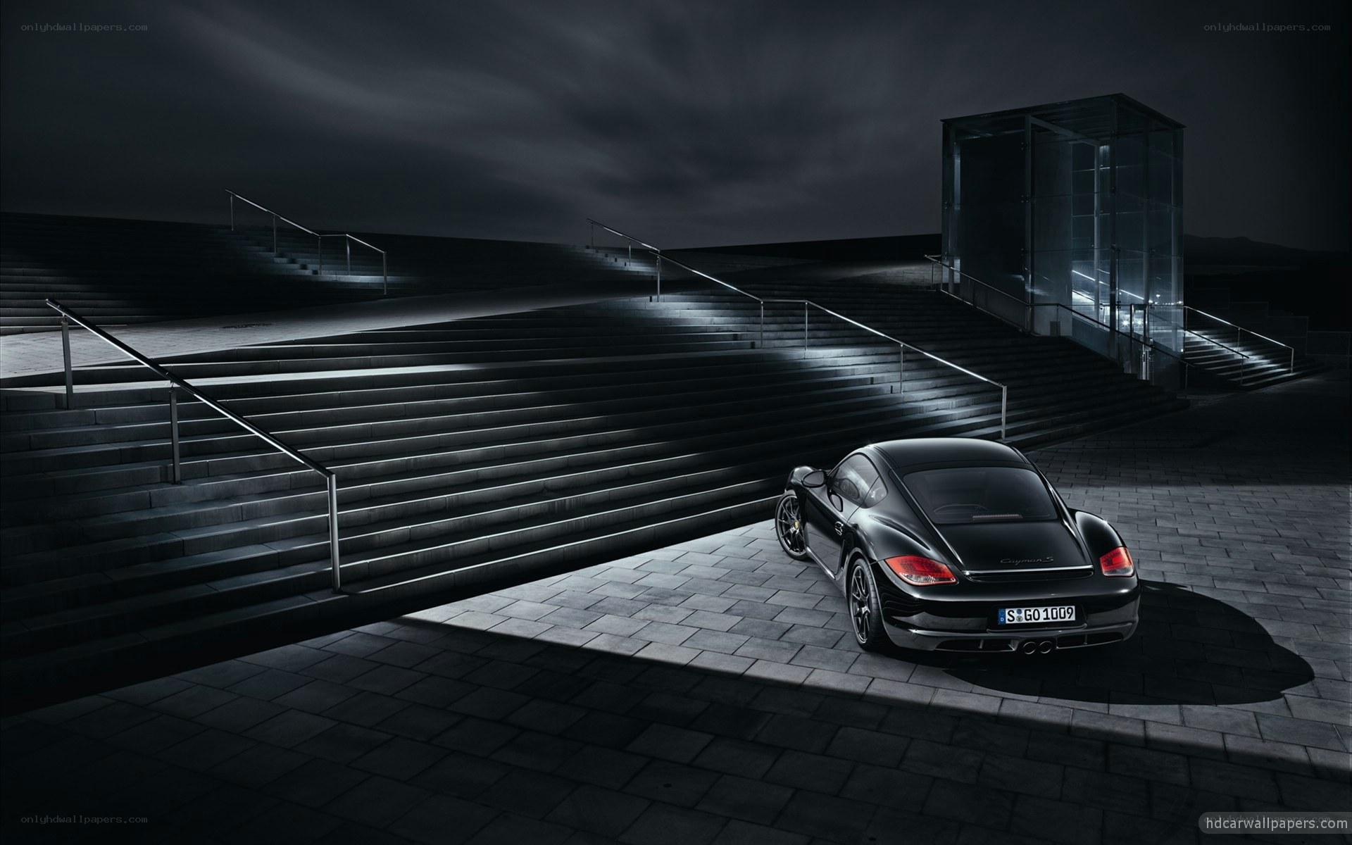 Black Porsche on dark stairs