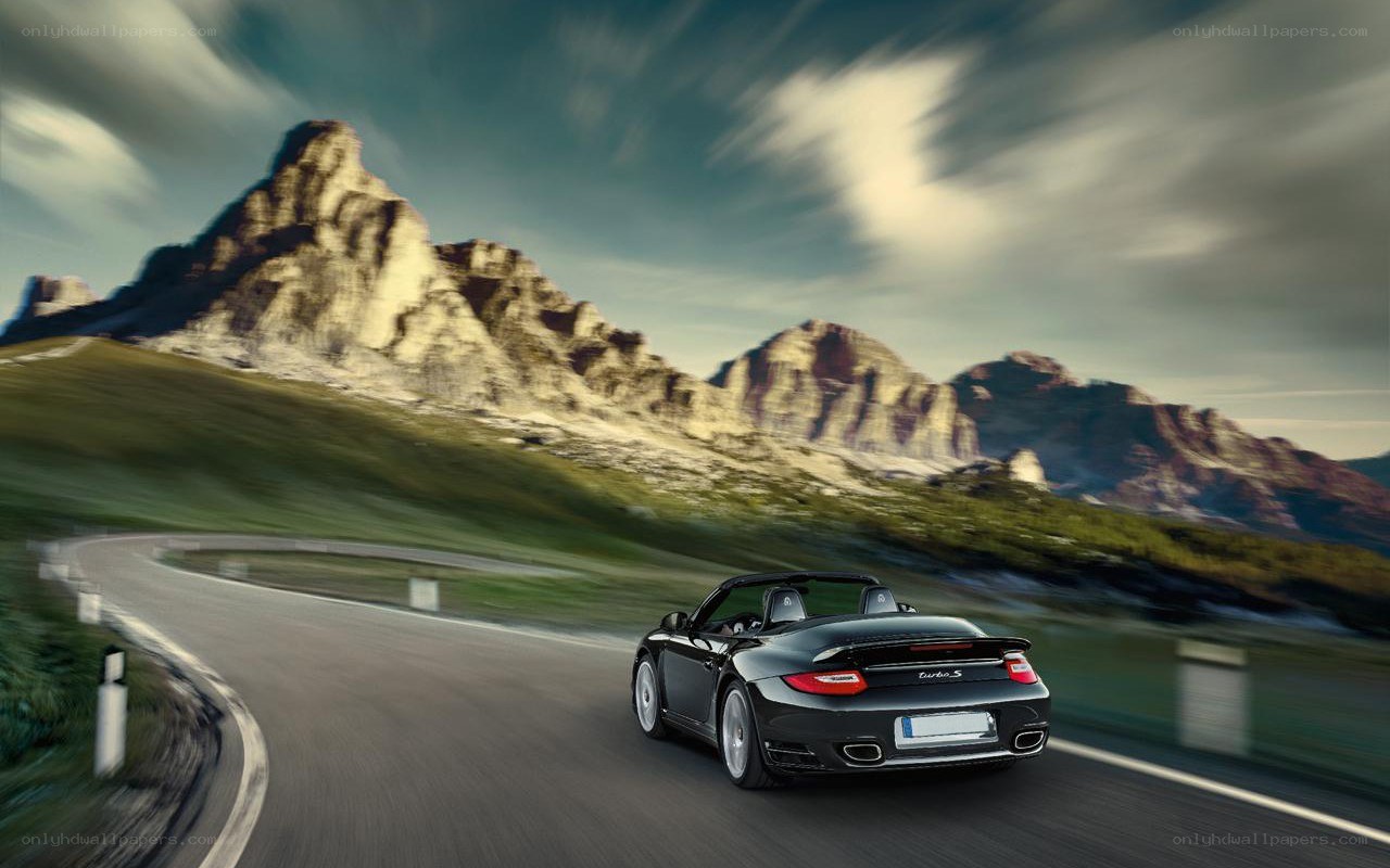 Black Porsche on mountain road