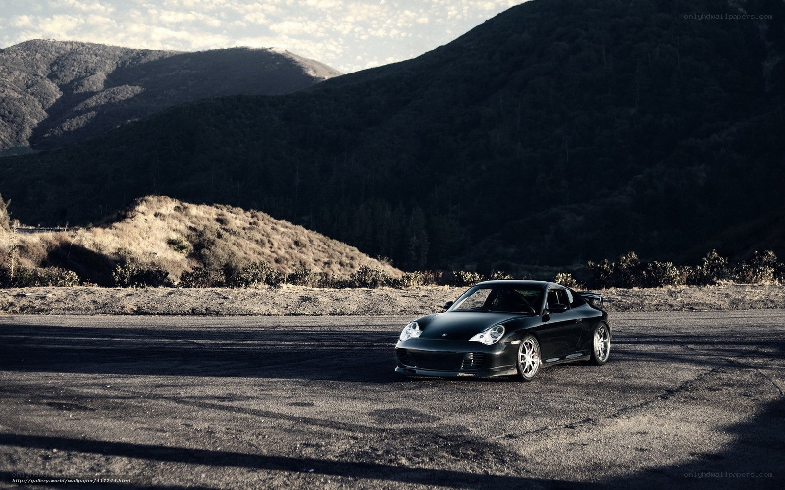 Black Porsche on mountain road