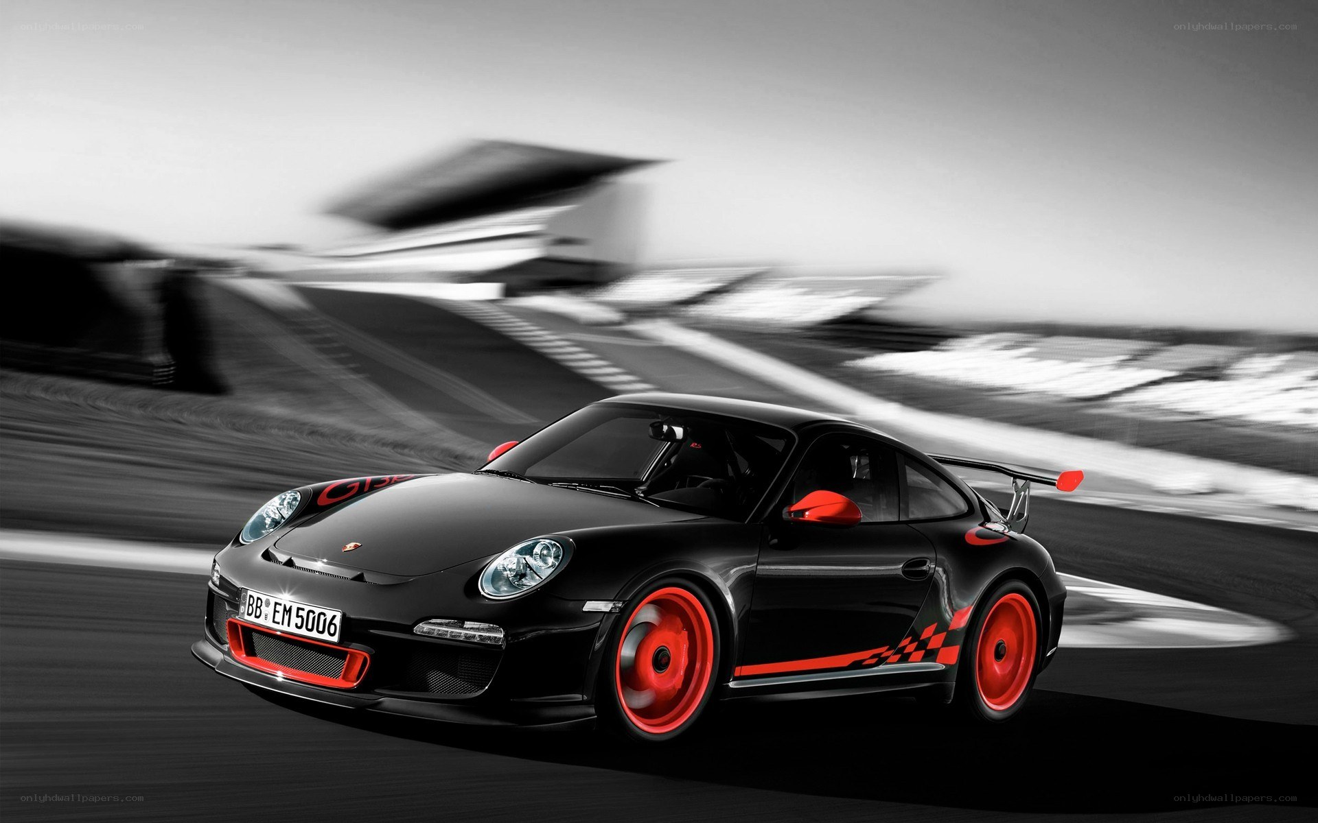 Black Porsche on racetrack
