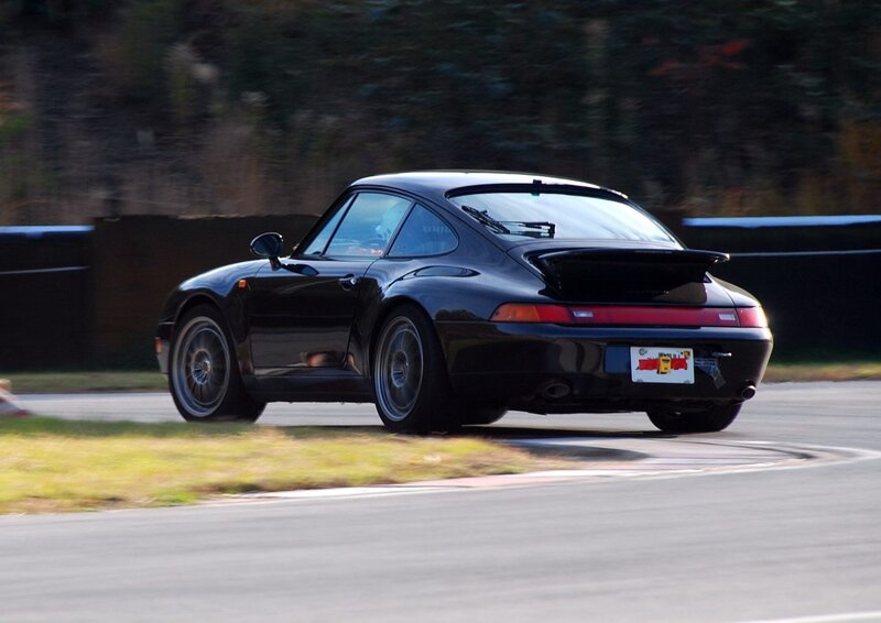 black porsche on racetrack