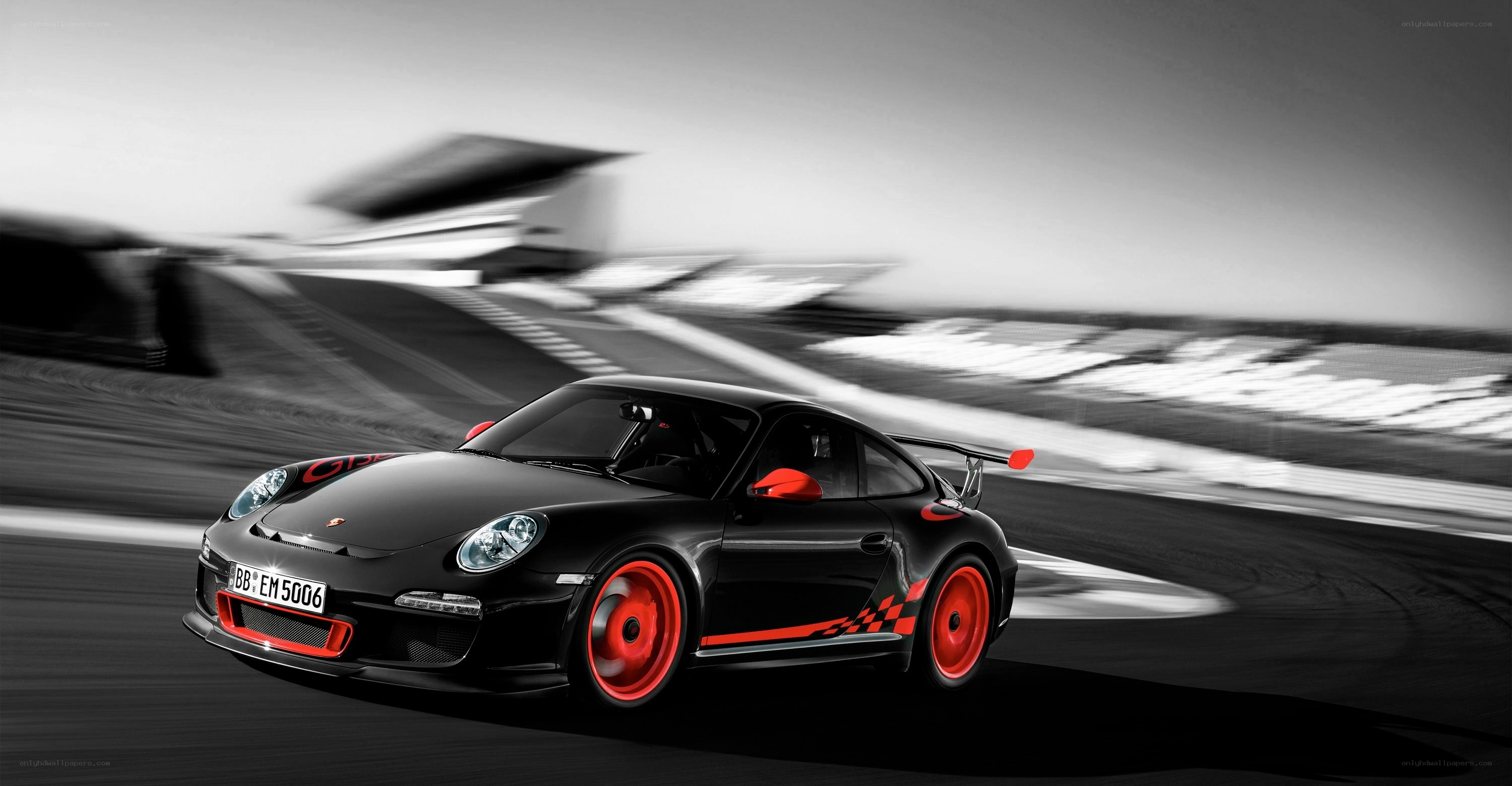 Black Porsche on racetrack