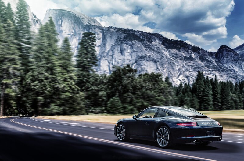 Black Porsche on Road — Dramatic