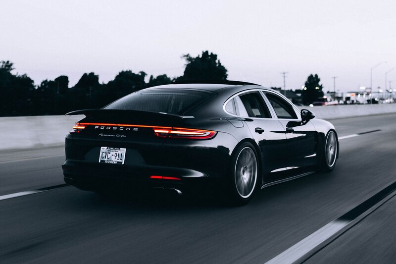 Black Porsche Panamera in motion