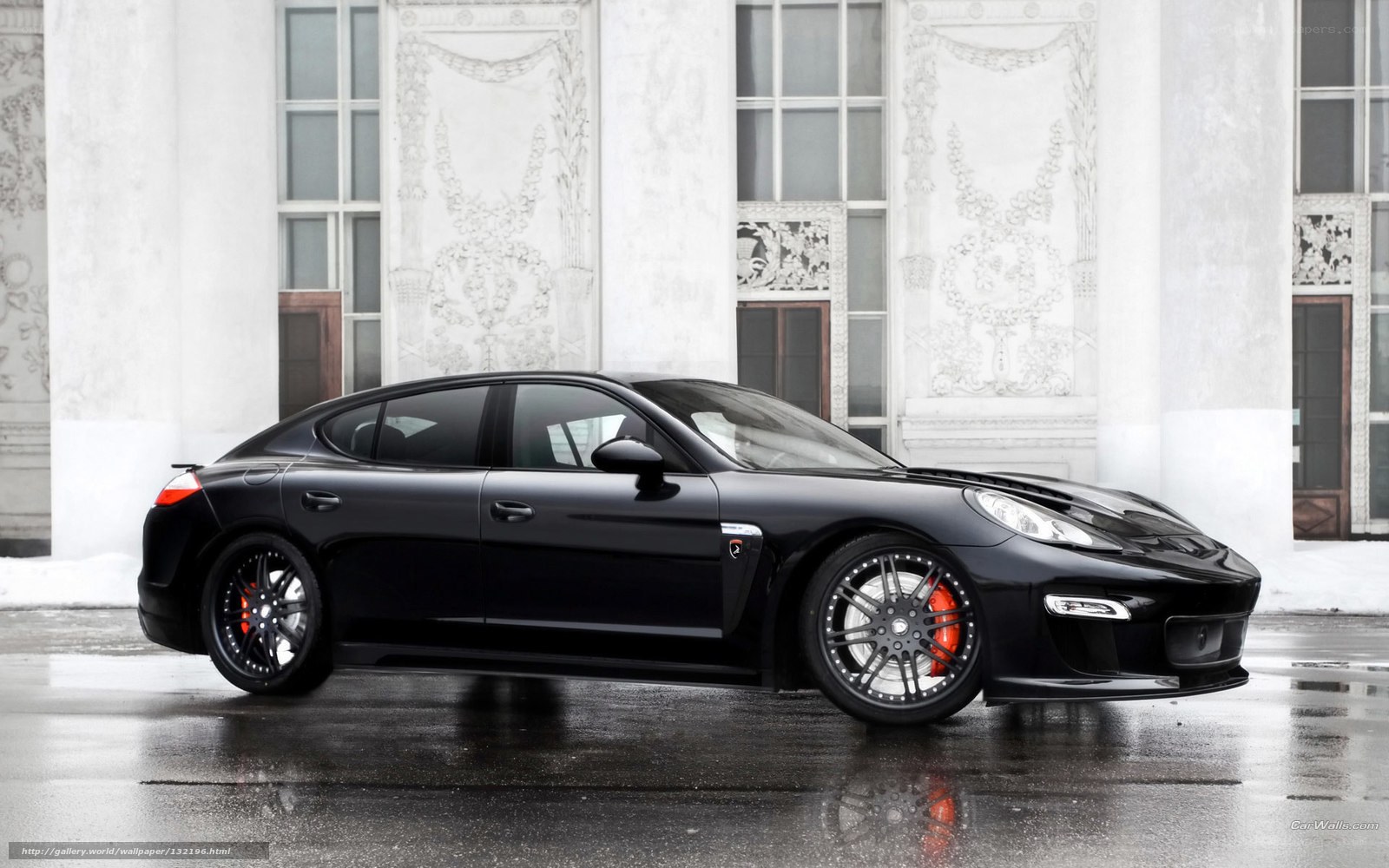 Black Porsche Panamera on wet street