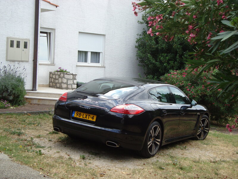 Black Porsche Panamera parked outside