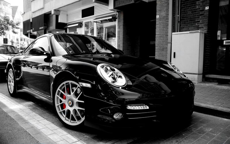 black porsche parked on street