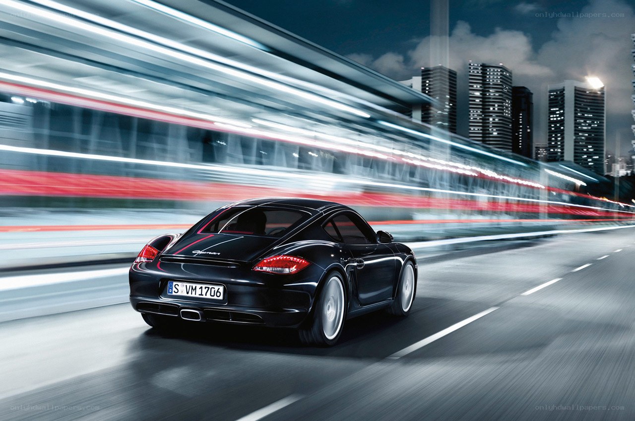 Black Porsche speeding through city