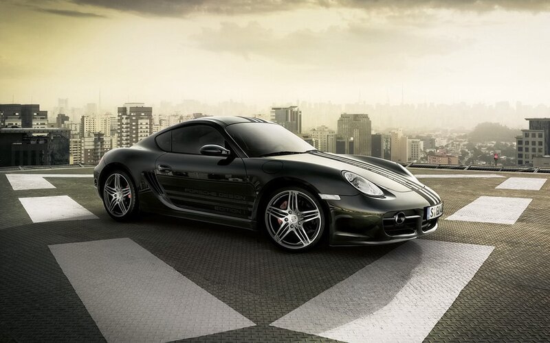 Black Porsche sports car on rooftop