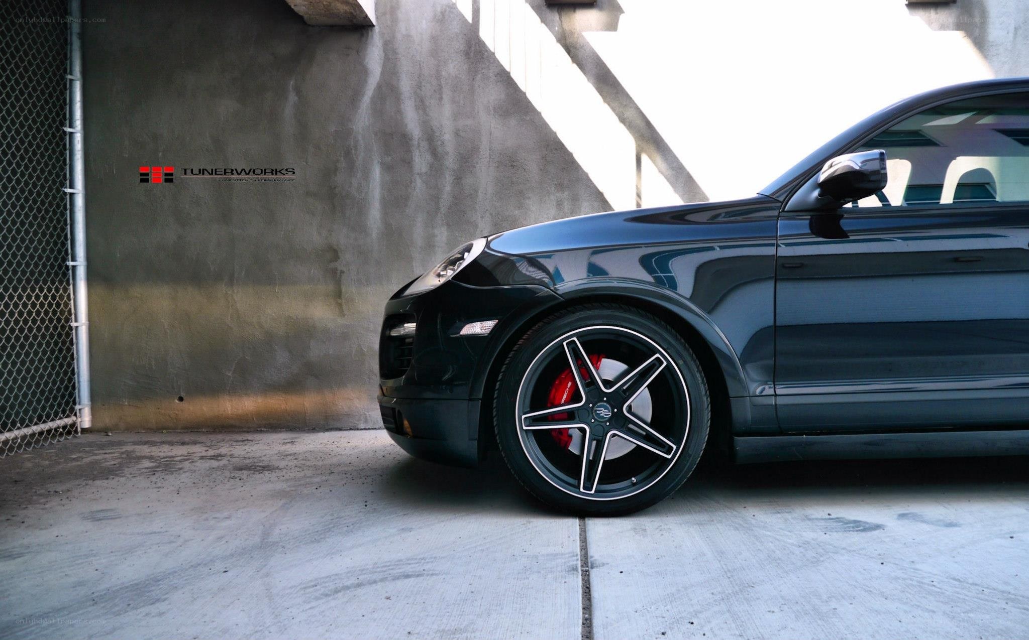 black porsche suv side view