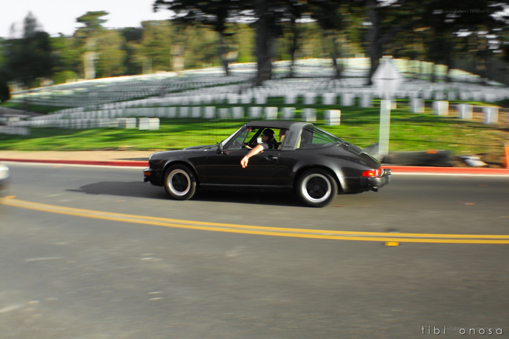 Black Porsche Targa in motion