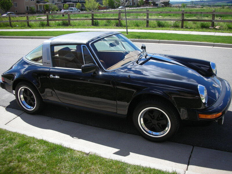 Black Porsche Targa parked on street