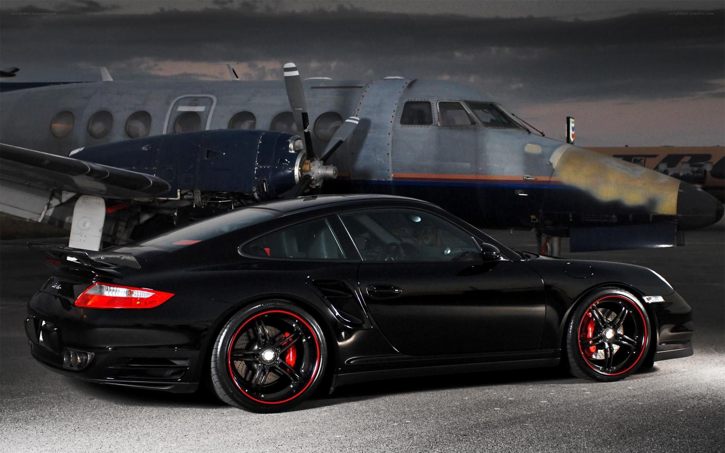 Black Porsche with airplane