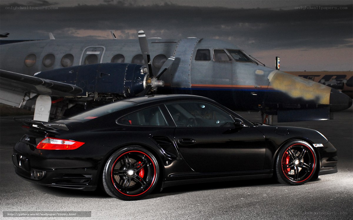 Black Porsche with airplane