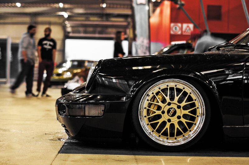 Black Porsche with Gold Wheels — Dramatic