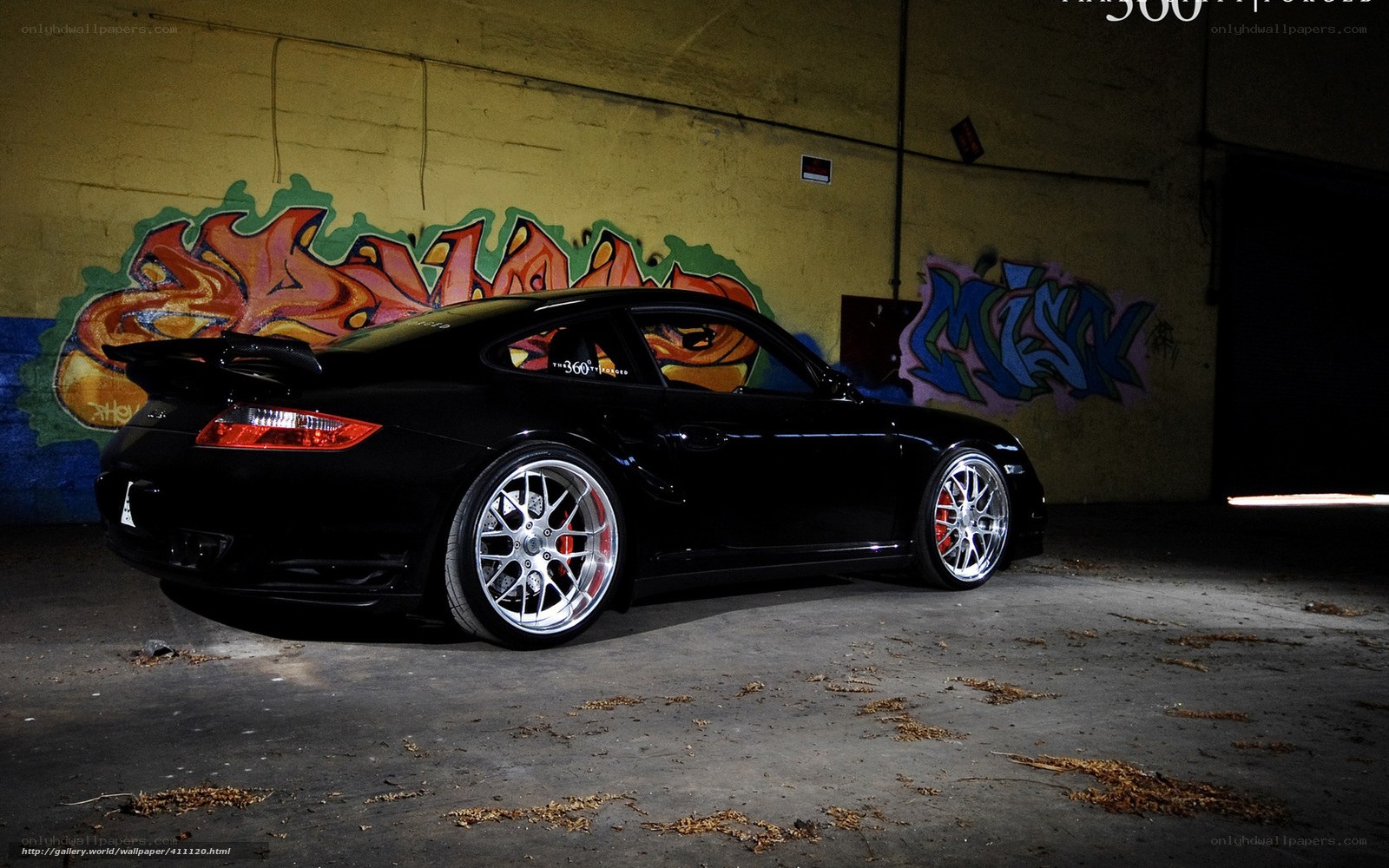 Black Porsche with graffiti