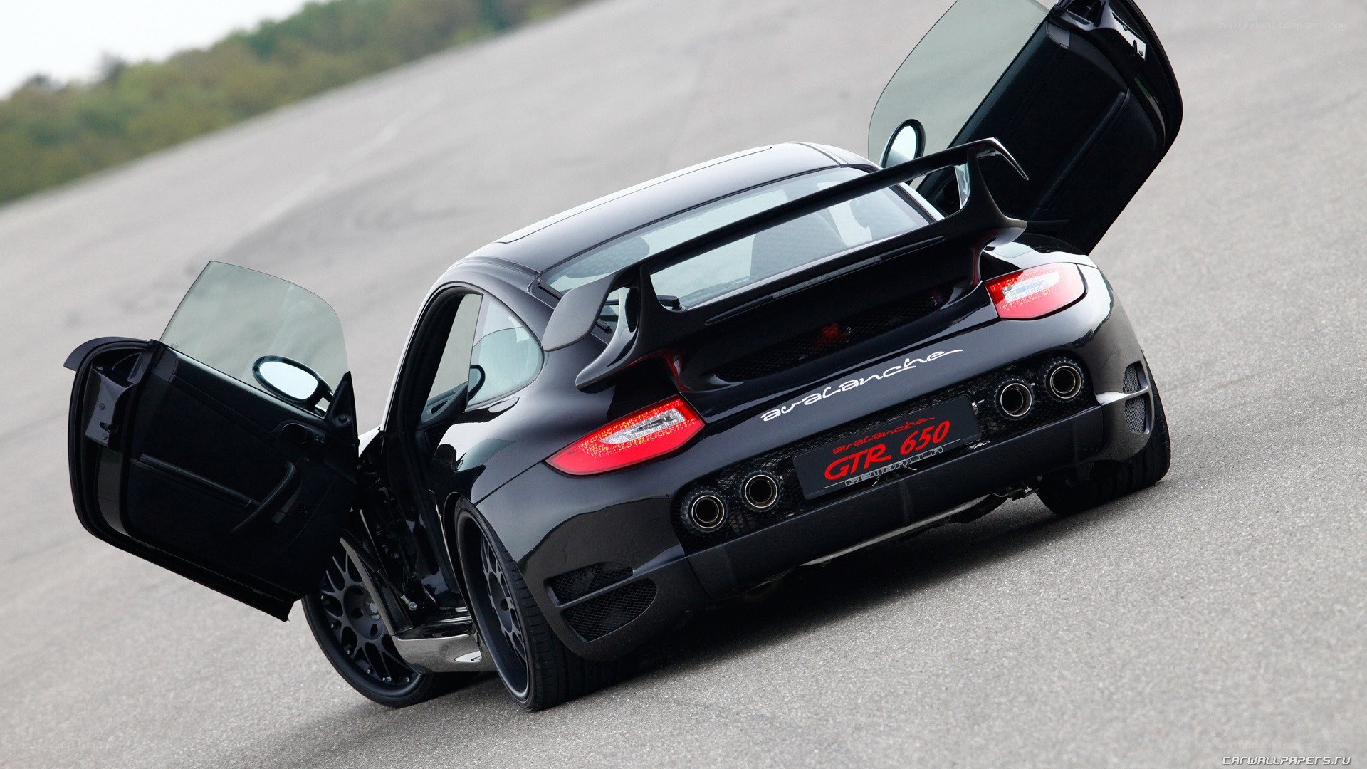 black porsche with open doors