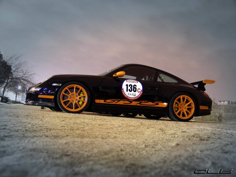 Black Porsche with orange accents