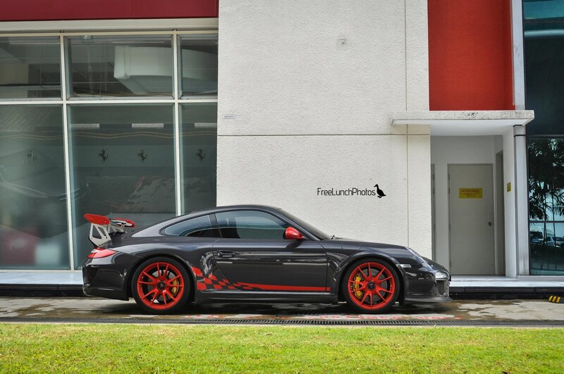Black Porsche with red accents