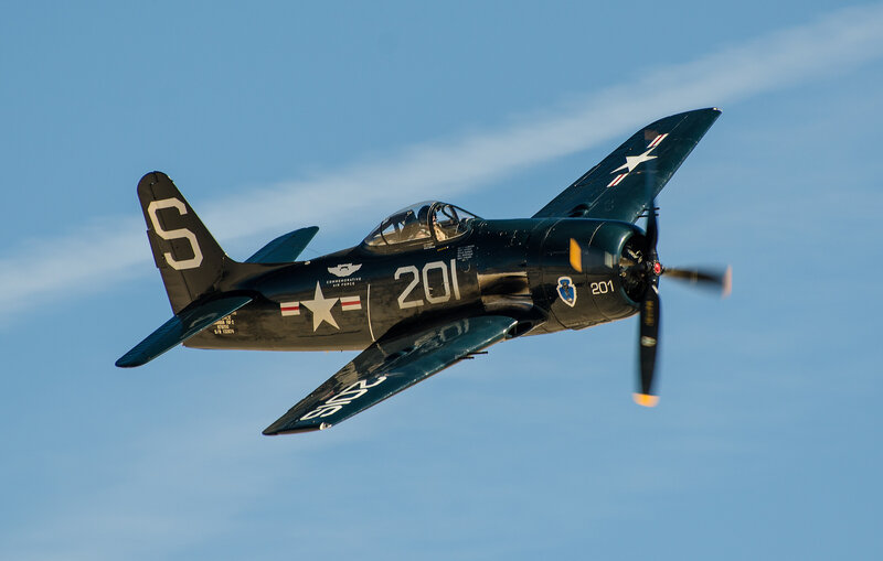 Black Propeller Plane — Blue, Dynamic, Afternoon