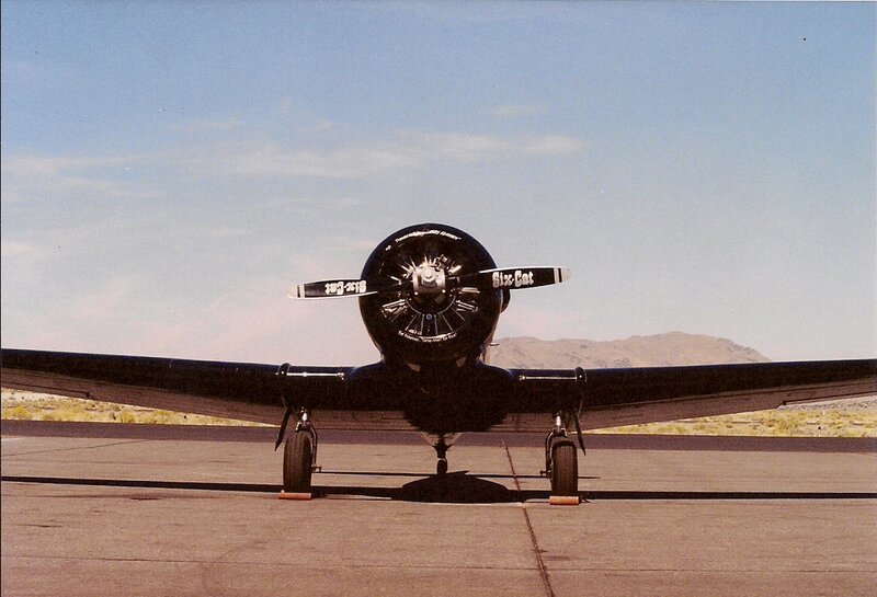 Black Propeller Plane — Calm, Afternoon, Photograph
