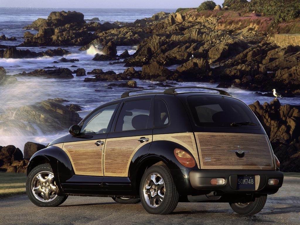 Black PT Cruiser by the coast