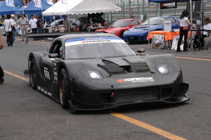 Black race car at a motorsport event