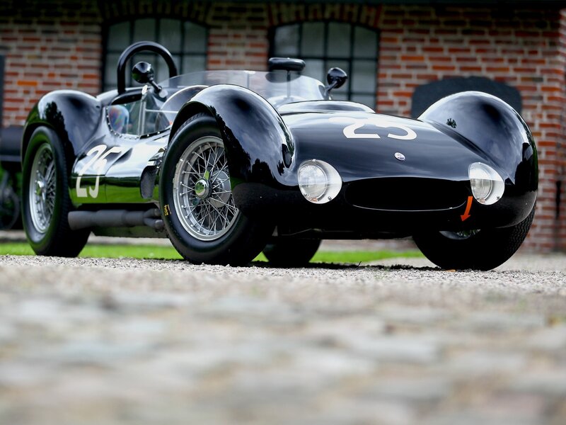 Black Race Car — Calm, Afternoon, Photograph, Brick Building