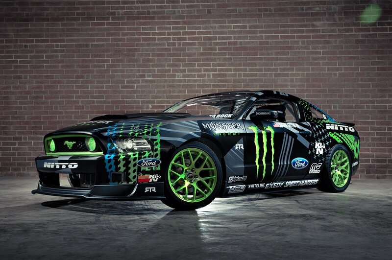 Black Race Car — Dramatic, Photograph, Brick Wall, Green Wheels