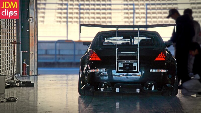 Black Race Car — Dramatic, Photograph, People, Fire Extinguisher