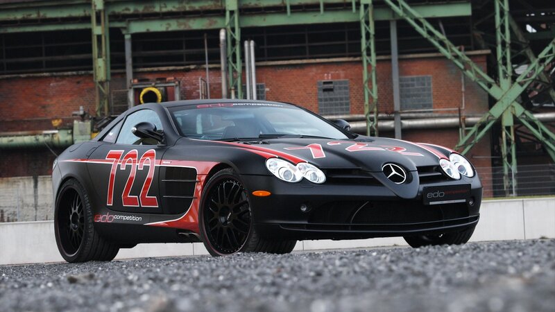 Black Race Car — Dramatic, Photograph, Race Car, Brick Building