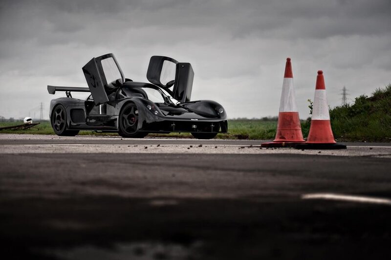 Black Race Car — Dramatic, Photograph, Traffic Cones