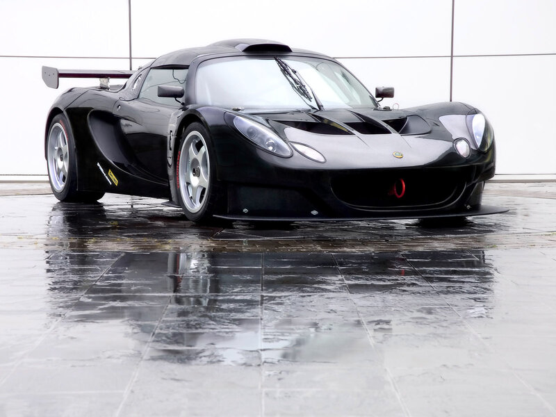 Black Race Car — Dramatic, Photograph, Wet Floor