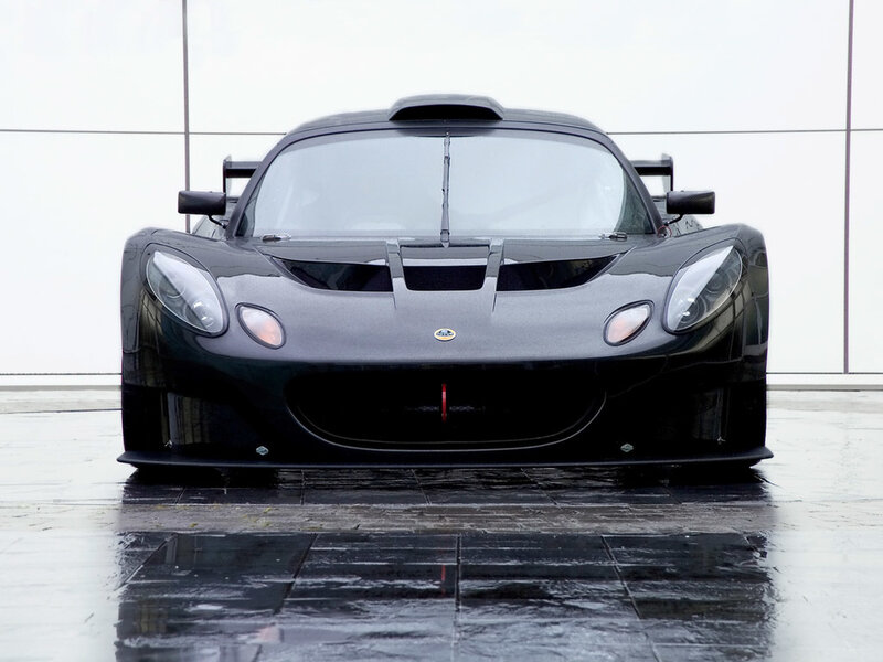 Black Race Car — Dramatic, Photograph, Wet Pavement, Building Facade