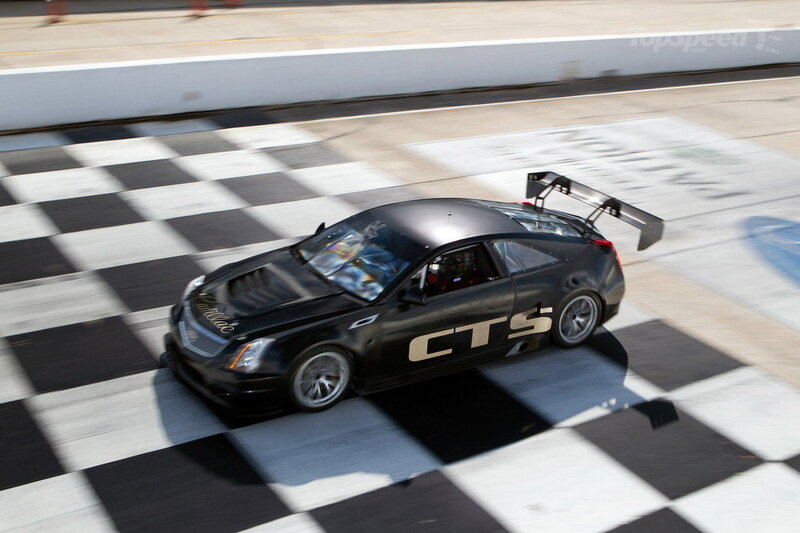 Black Race Car — Dynamic, Afternoon, Photograph, Race Track, Checkered Flag