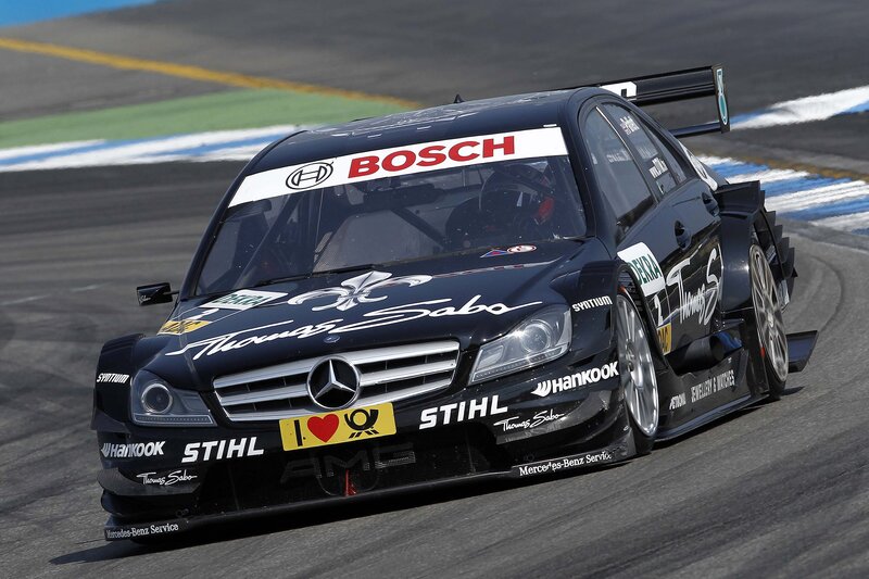 Black Race Car — Dynamic, Afternoon, Photograph, Race Track, Driver, Sponsor Logos