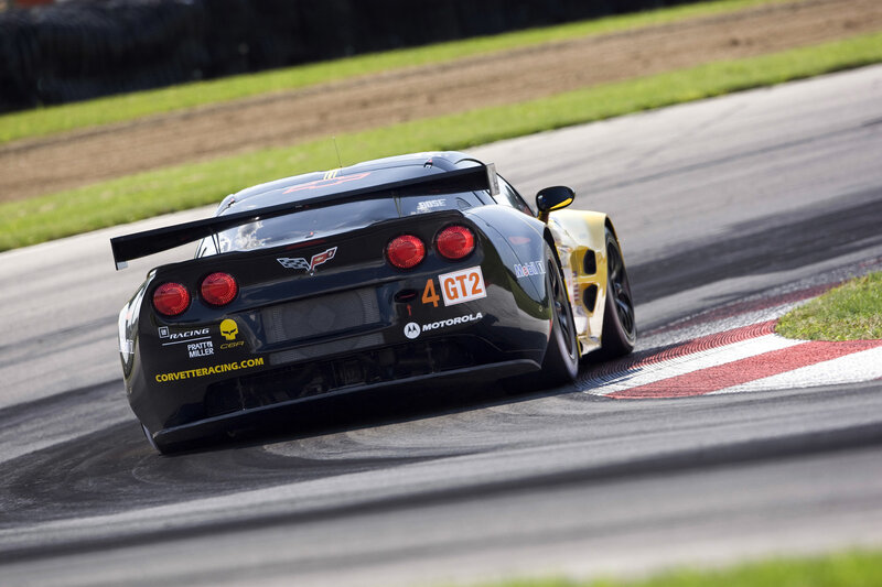 Black Race Car — Dynamic, Afternoon, Photograph, Race Track, Grass, Tire Marks