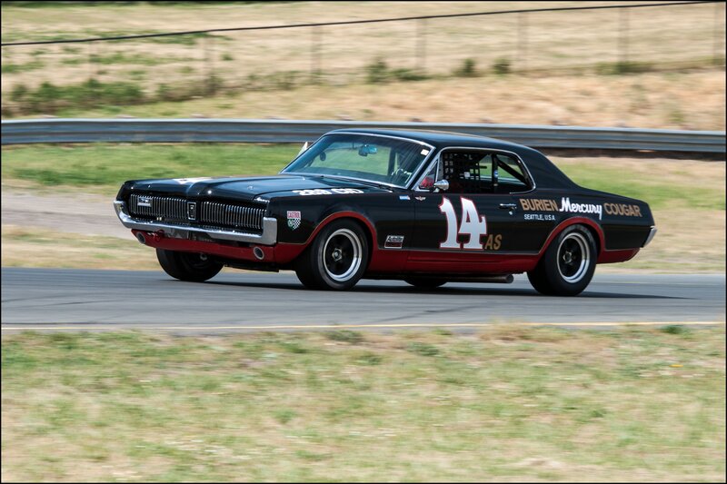 Black Race Car — Dynamic, Afternoon, Photograph, Race Track, Guardrail