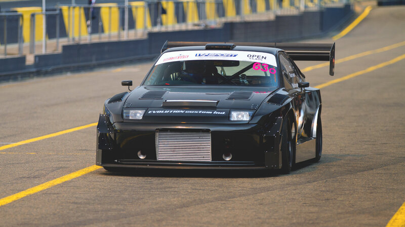 Black Race Car — Dynamic, Afternoon, Photograph, Race Track, Yellow Lines