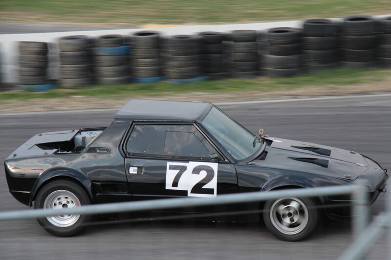 Black Race Car — Dynamic, Afternoon, Photograph, Tires