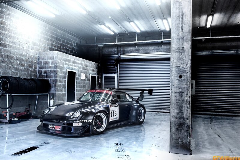 Black race car in garage
