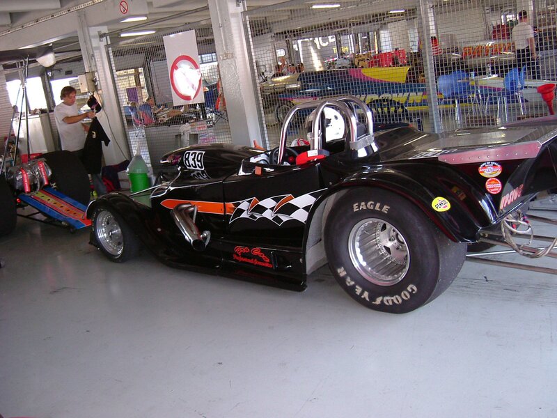 Black race car in garage