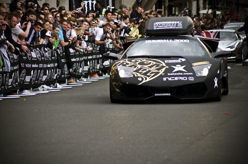 Black race car on city street