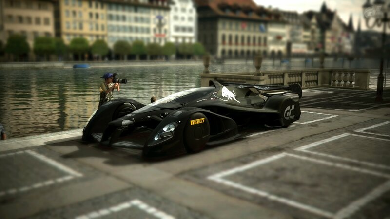 Black race car on city street