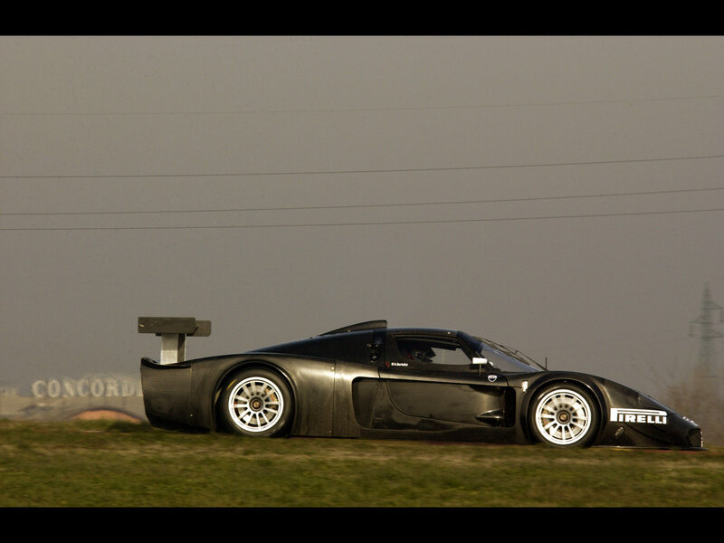 Black race car on grass