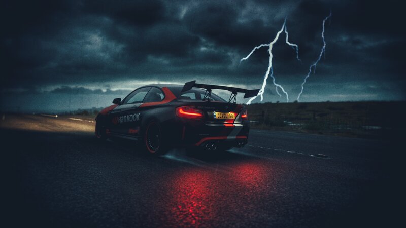 Black Race Car on Road — Dramatic, Night
