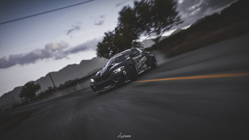 Black Race Car on Road — Dramatic, Sunset