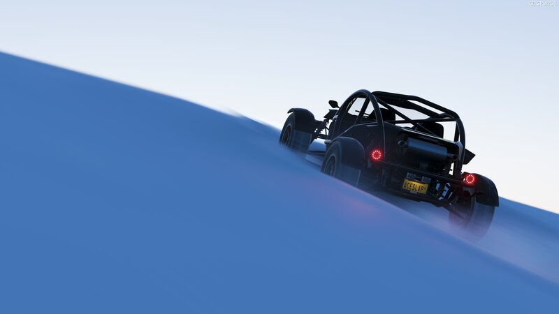 Black Race Car on Sand Dune