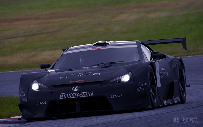 black race car on track