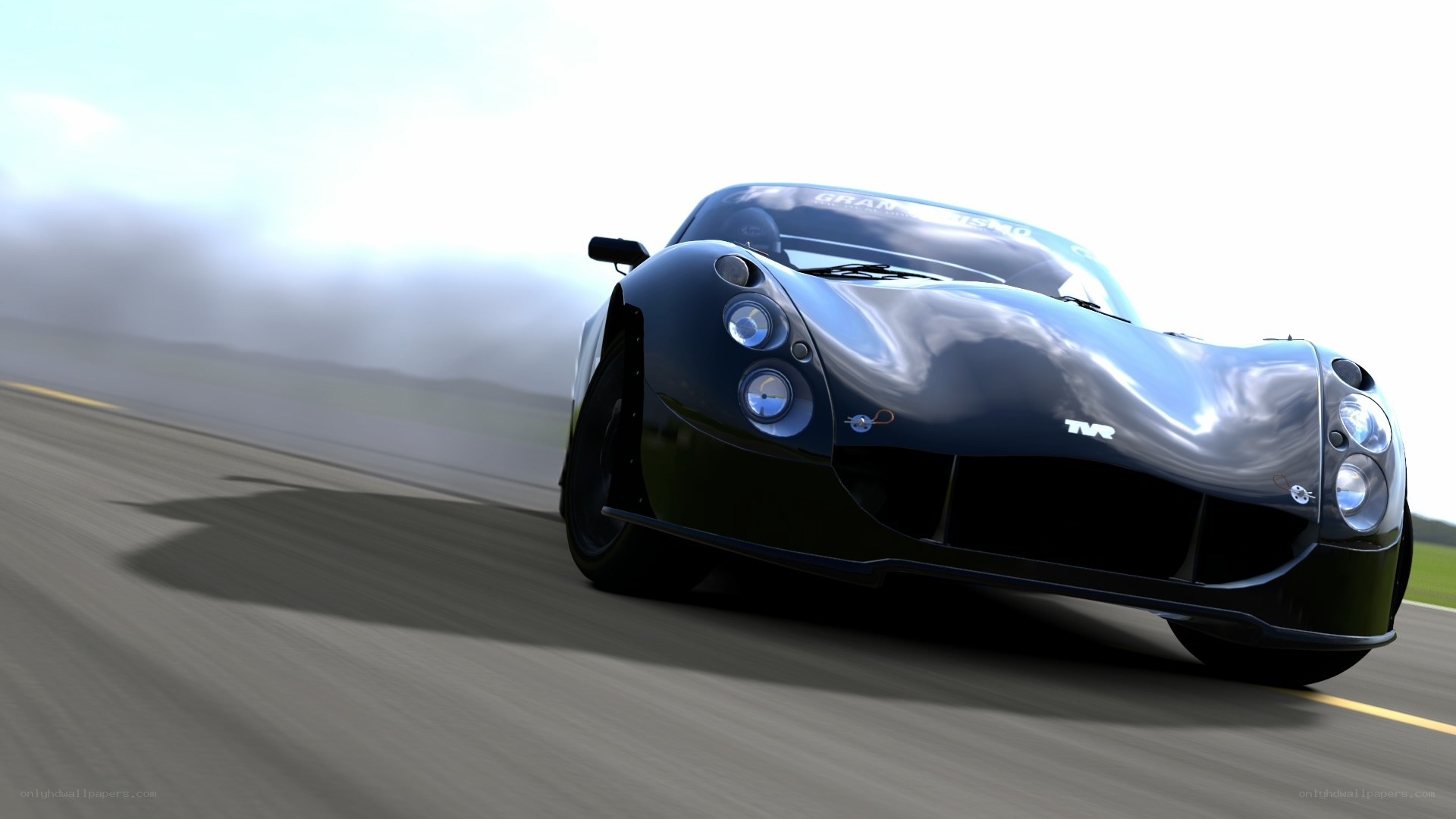 black race car on track
